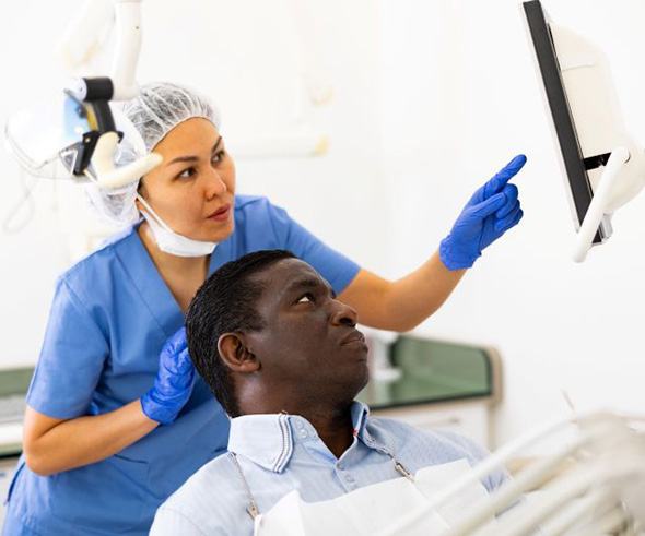 Dentist and patient talking during consultation