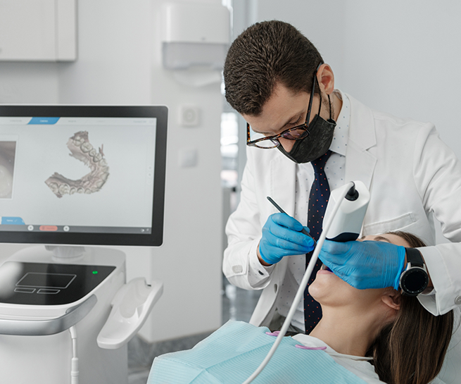 Dentist capturing digital impressions of a patients teeth