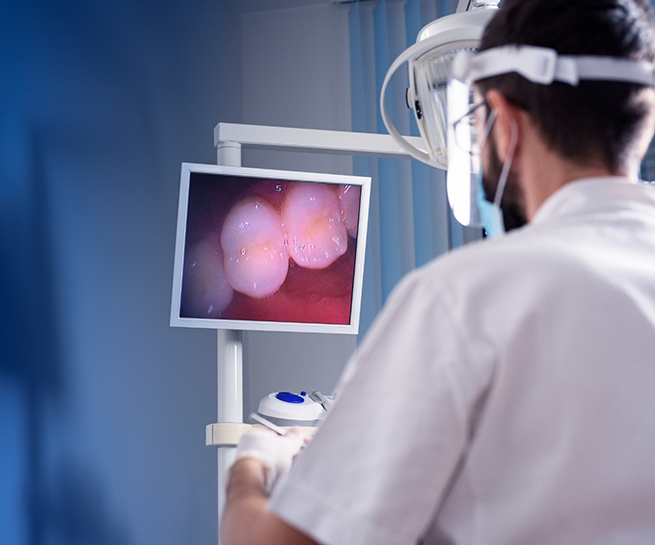 Dentist capturing close up photos of a patients teeth