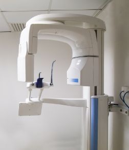 Dental scanning machine standing against a wall