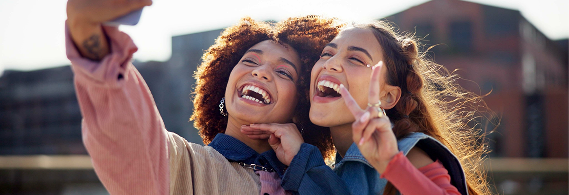 Two young women taking a selfie after visiting their dentist in Beaverton