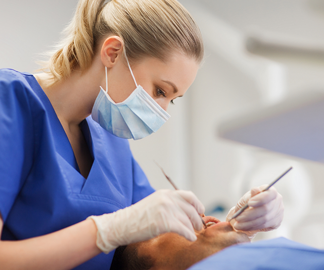 Dentist giving a patient a dental exam
