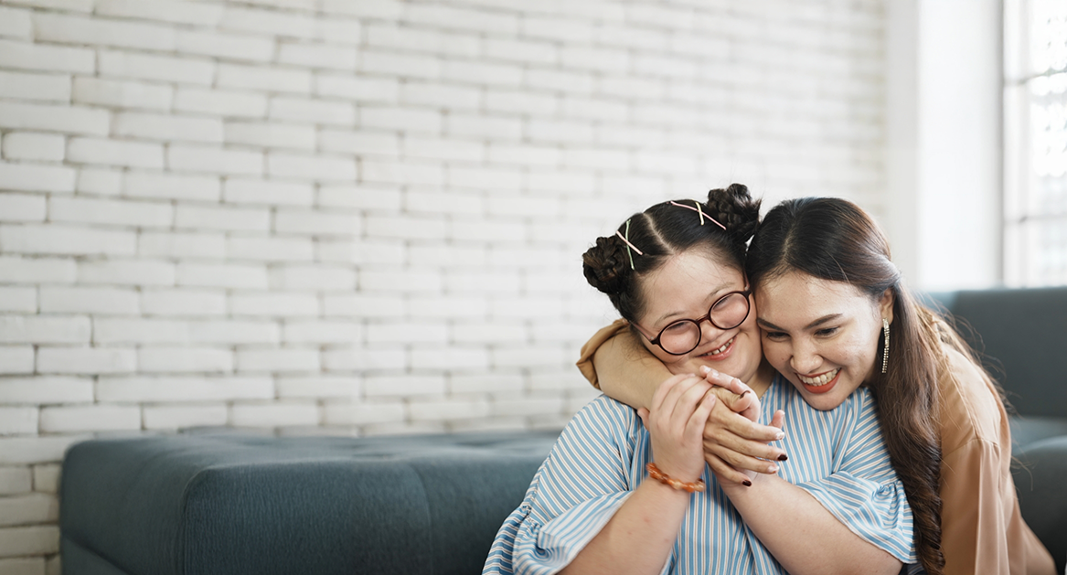 Mother hugging her daughter after visiting special needs dentist in Beaverton