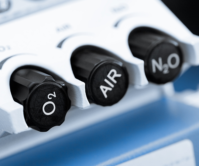 Buttons for nitrous oxide and oxygen on a sedation machine
